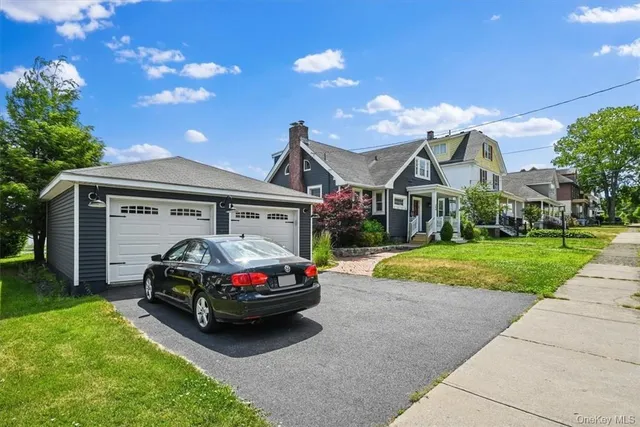 a car parked in front of a house