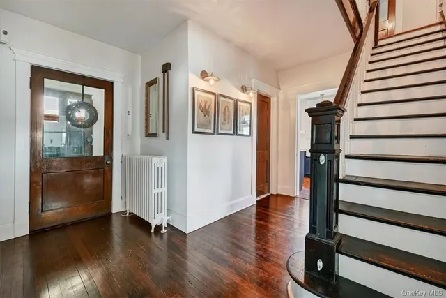 a view of entryway with wooden floor