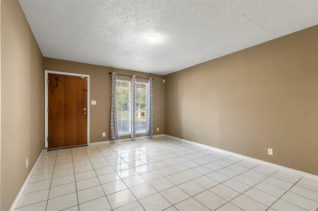 a view of an empty room with window