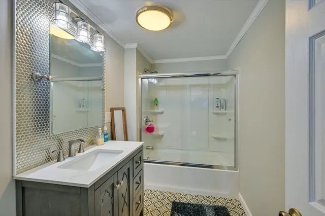 a bathroom with a sink toilet and mirror