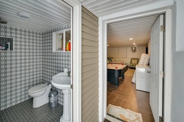 a bathroom with a shower and a sink