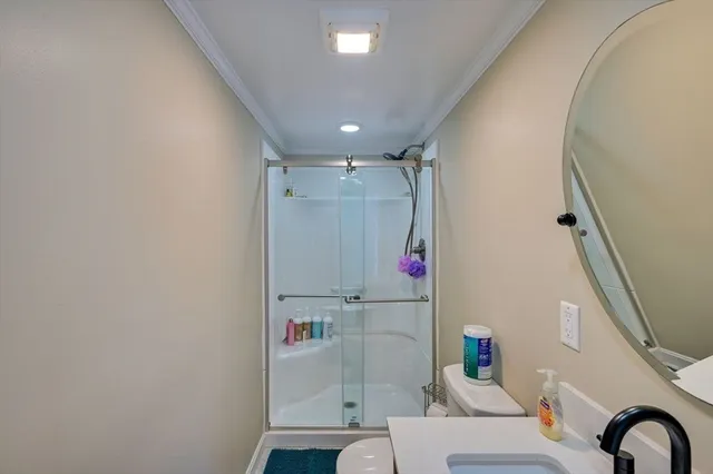 a view of a lake with table and chairs