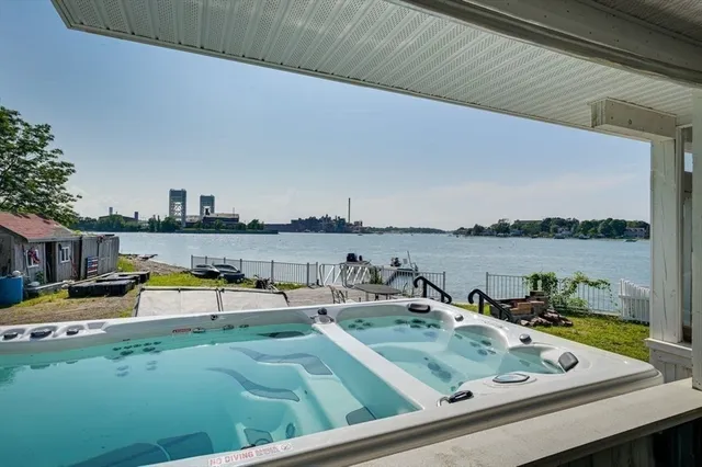 a front view of a house with a yard table and chairs
