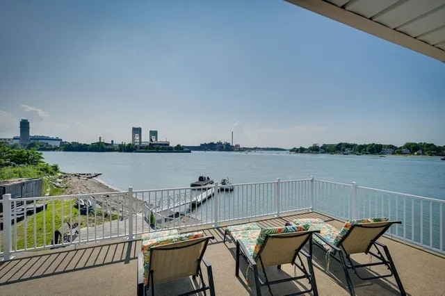 a view of a balcony with chairs