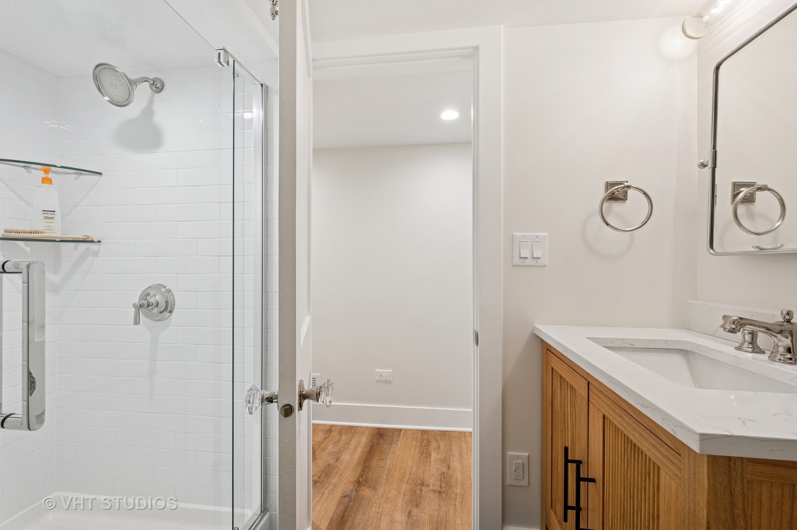 720 Willow Road Winnetka, IL 60093 - Photo 20 of 28 a bathroom with a sink vanity and a mirror