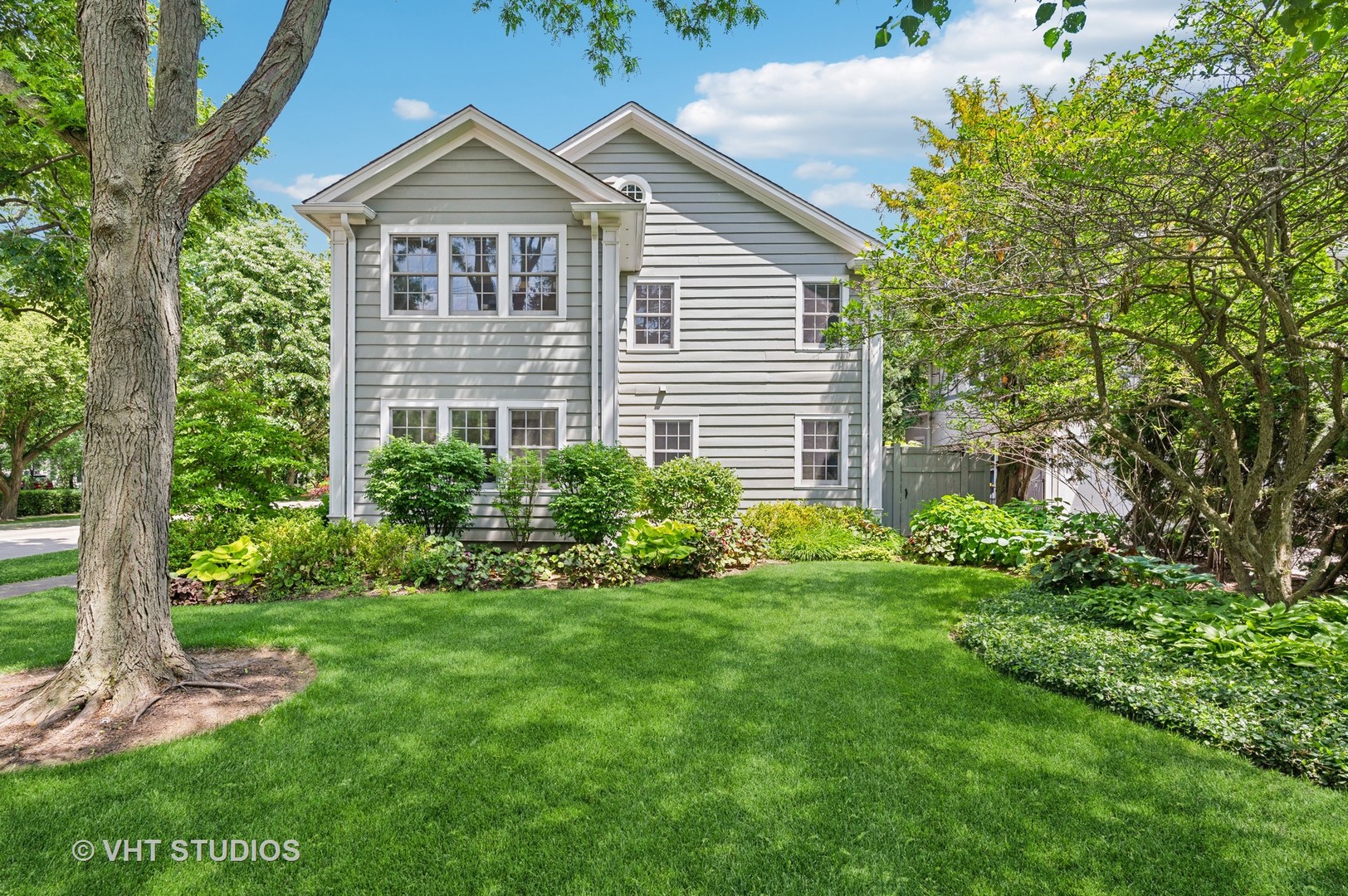 720 Willow Road Winnetka, IL 60093 - Photo 23 of 28 front view of a house with a yard