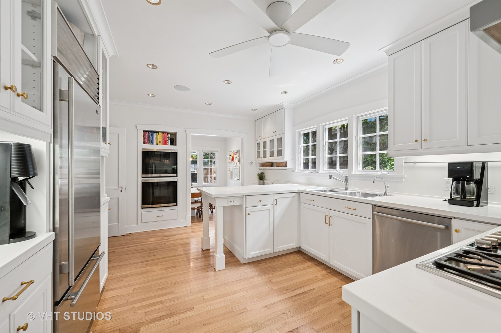 720 Willow Road Winnetka, IL 60093 - Photo 3 of 28 a kitchen with a sink appliances and cabinets
