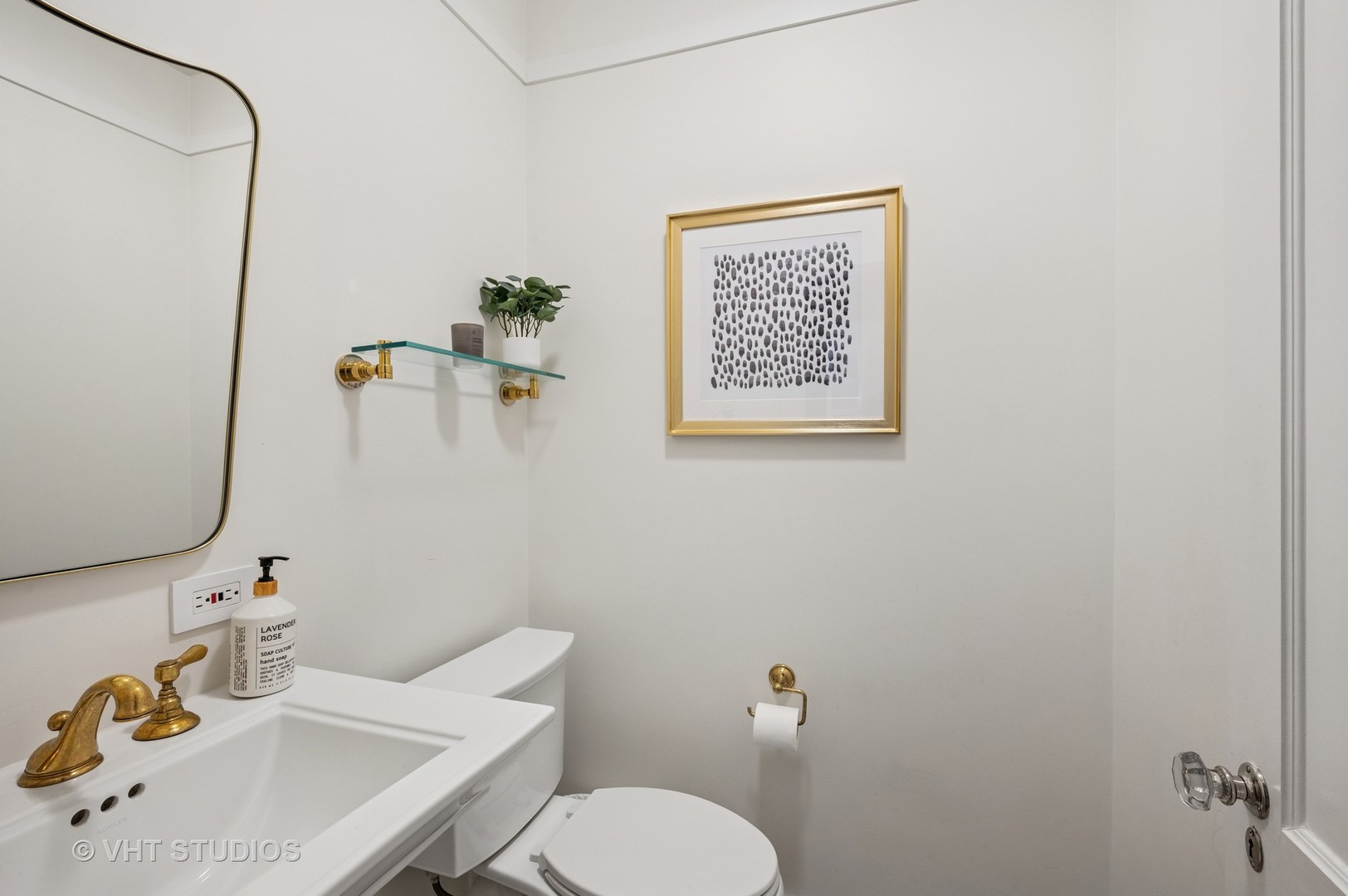 720 Willow Road Winnetka, IL 60093 - Photo 8 of 28 a bathroom with a sink mirror and toilet