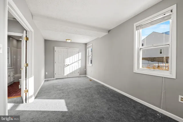 an empty room with windows