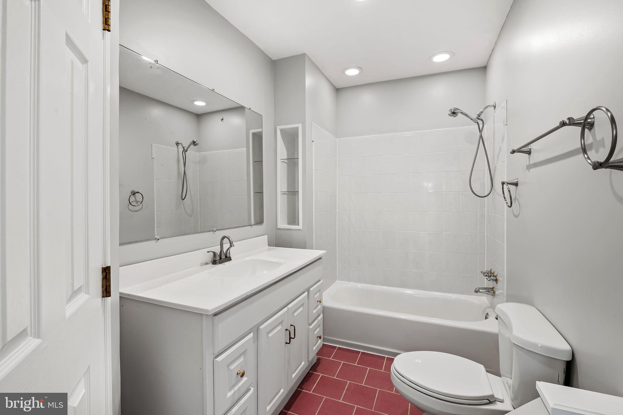 4222 Klosterman Avenue Nottingham, MD 21236 - Photo 17 of 43 a bathroom with a sink a toilet and a bathtub