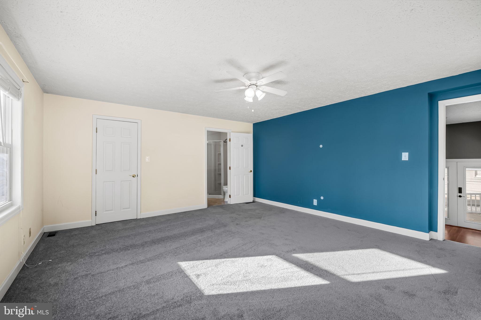4222 Klosterman Avenue Nottingham, MD 21236 - Photo 18 of 43 a view of an empty room with a ceiling fan