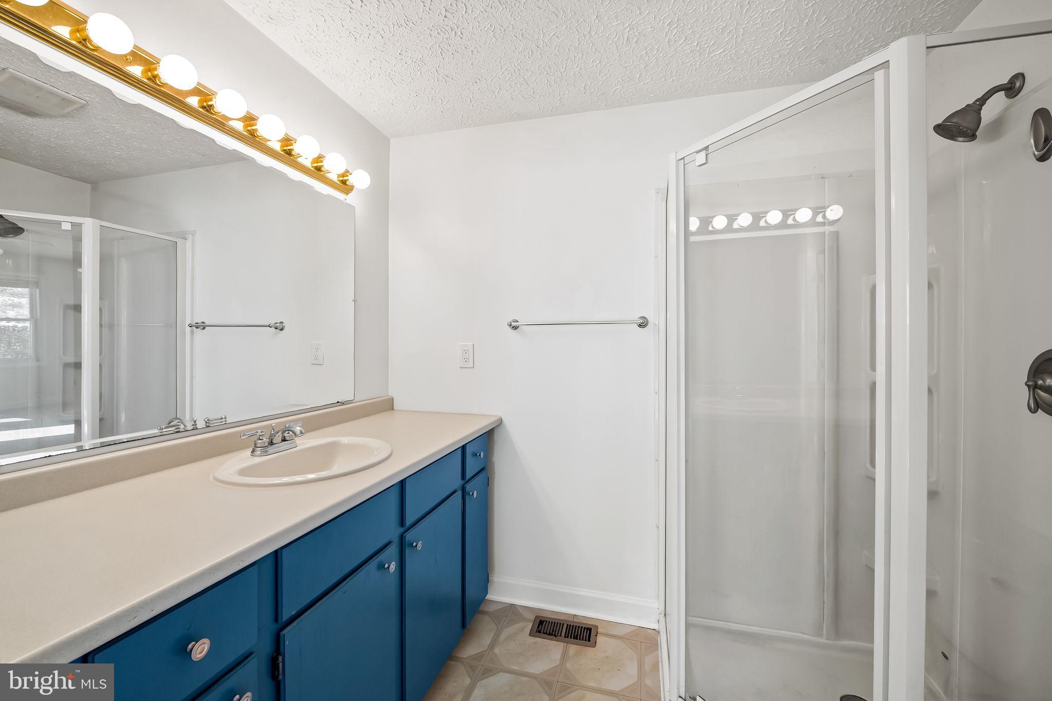 4222 Klosterman Avenue Nottingham, MD 21236 - Photo 21 of 43 a bathroom with a sink and a mirror
