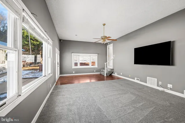a view of a livingroom with wooden floor