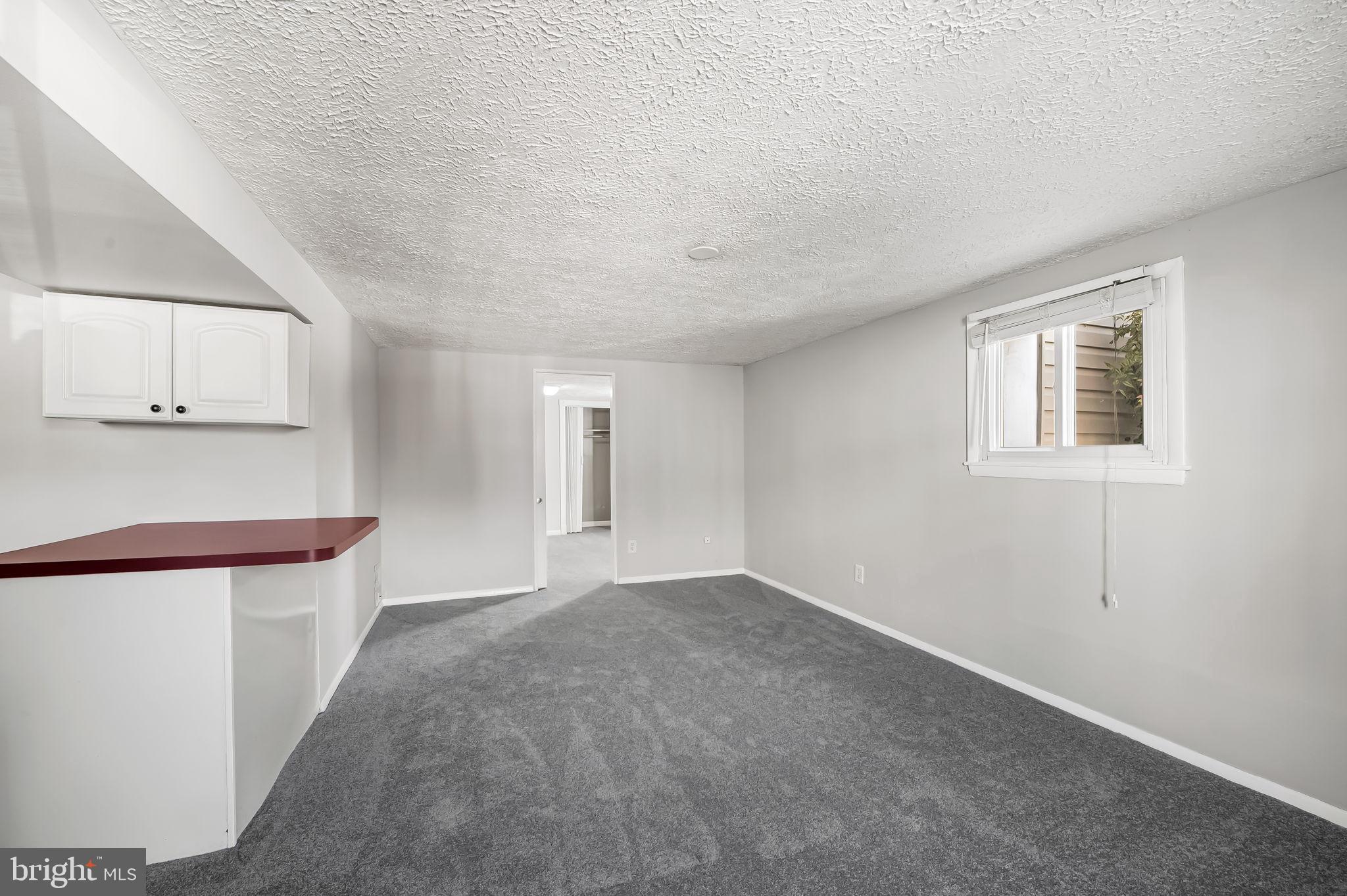 4222 Klosterman Avenue Nottingham, MD 21236 - Photo 29 of 43 a view of an empty room with window and wooden floor