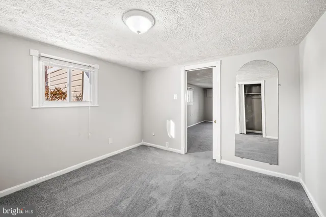 a view of storage and utility room with washer and dryer