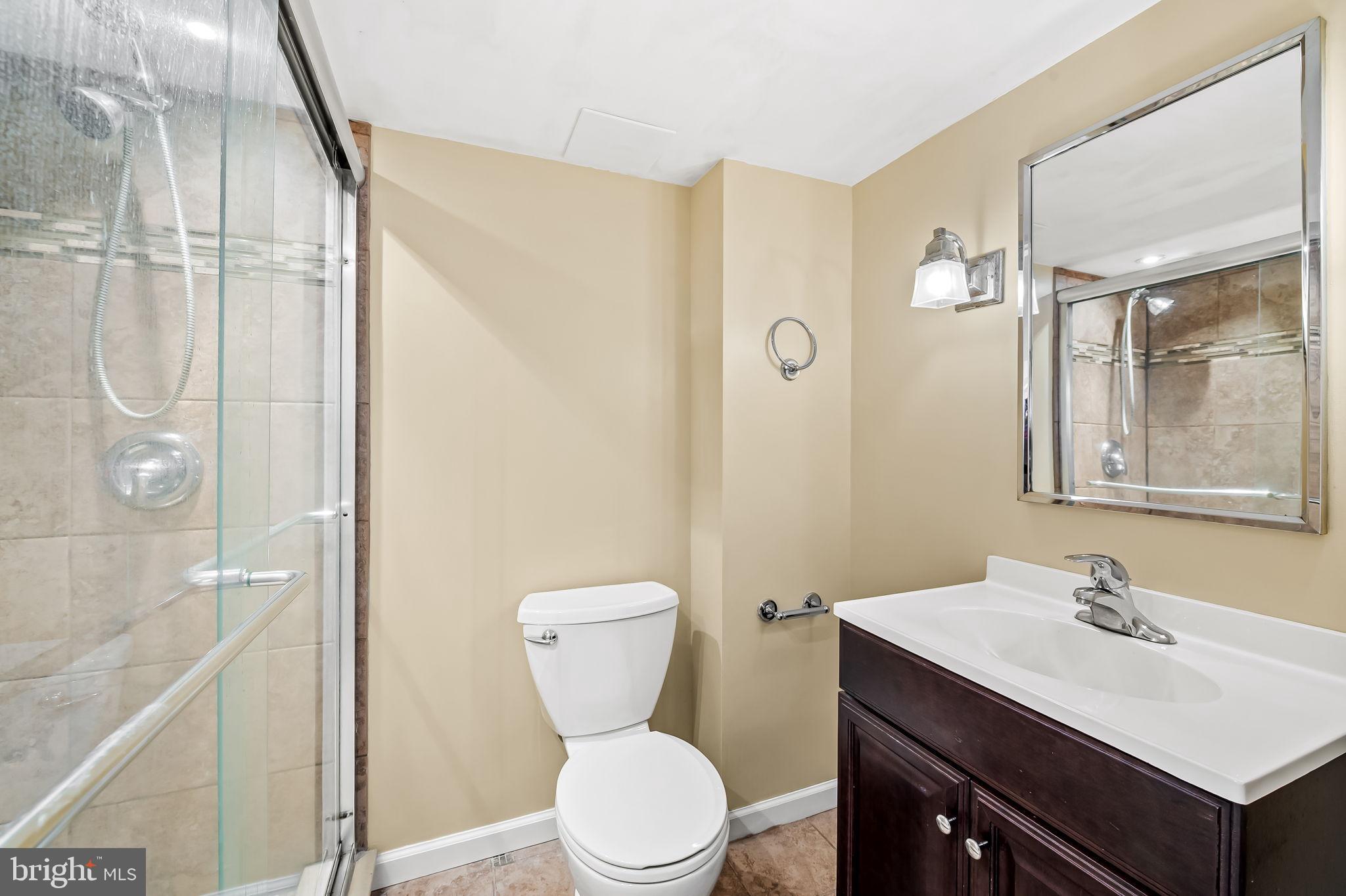 4222 Klosterman Avenue Nottingham, MD 21236 - Photo 33 of 43 a bathroom with a sink toilet and shower