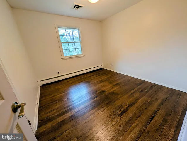 a view of a room with an empty shelf
