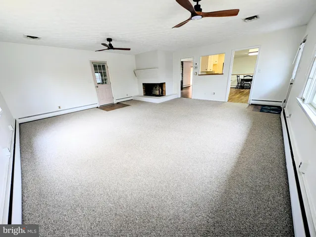 a bathroom with a sink a toilet and a shower