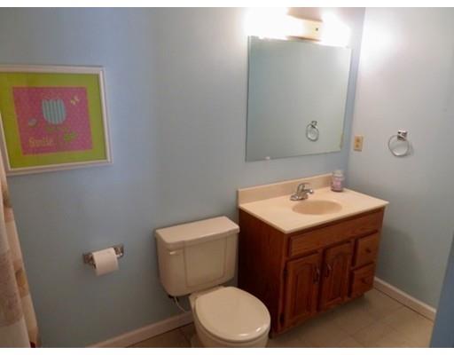 408 Southampton Road Holyoke, MA 01040 - Photo 18 of 22 a bathroom with a toilet sink and mirror