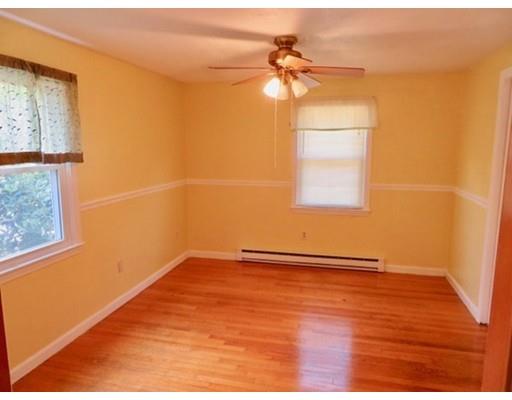 408 Southampton Road Holyoke, MA 01040 - Photo 5 of 22 a view of a room with wooden floor and a ceiling fan