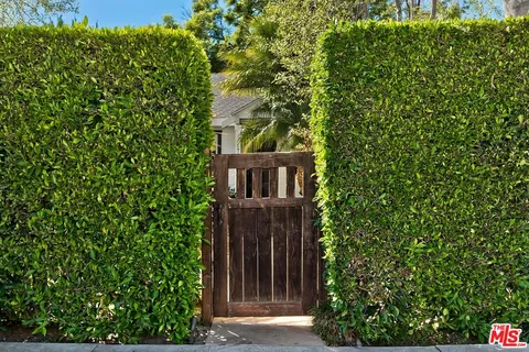 a view of a house with a tree