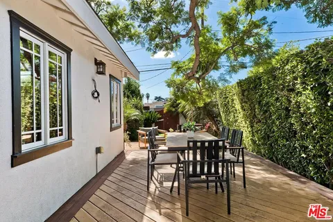 a view of a patio with a table and chairs