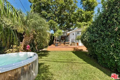 a view of swimming pool with a patio