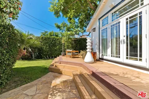a view of a swimming pool with an outdoor space and seating area