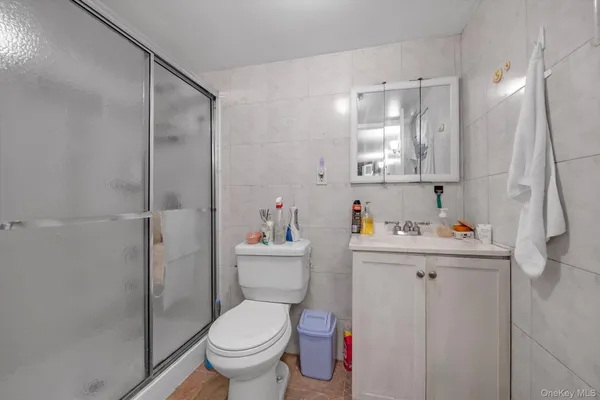 a bathroom with a toilet sink and shower