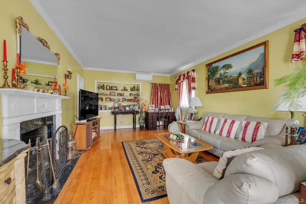 a living room with furniture fireplace and flat screen tv