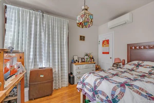 a bedroom that has a bed and a couch in it