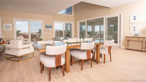 a bed sitting in a bedroom next to a large window