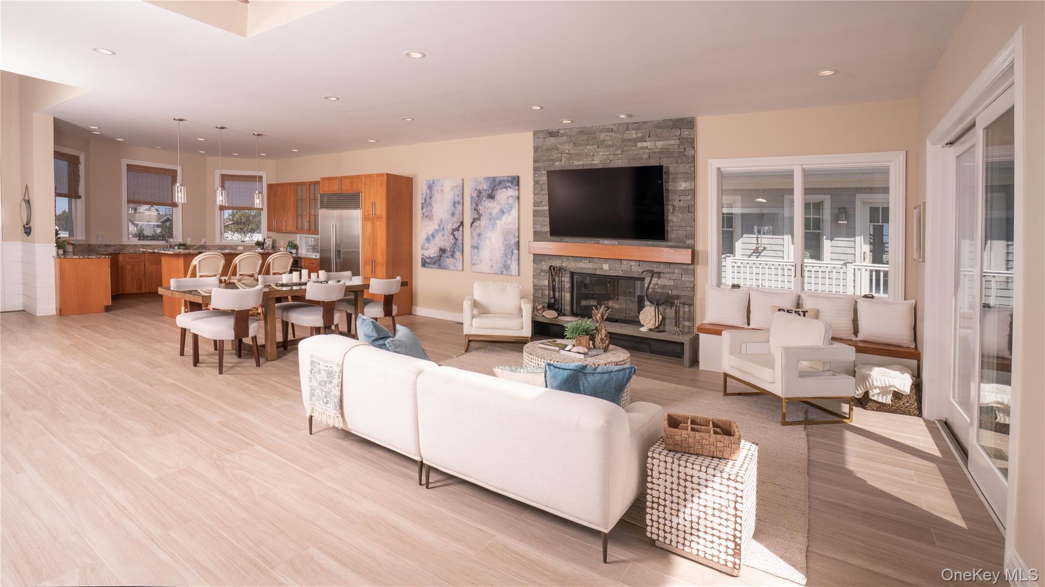 825 Dune Road Westhampton Beach, NY 11978 - Photo 16 of 50 a living room with furniture and a flat screen tv