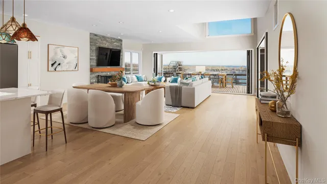a view of a living room and kitchen with furniture