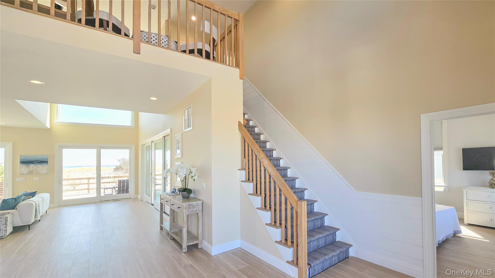 825 Dune Road Westhampton Beach, NY 11978 - Photo 22 of 50 a view of entryway and hall with wooden floor