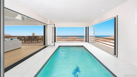 a front view of a house with yard and barbeque oven