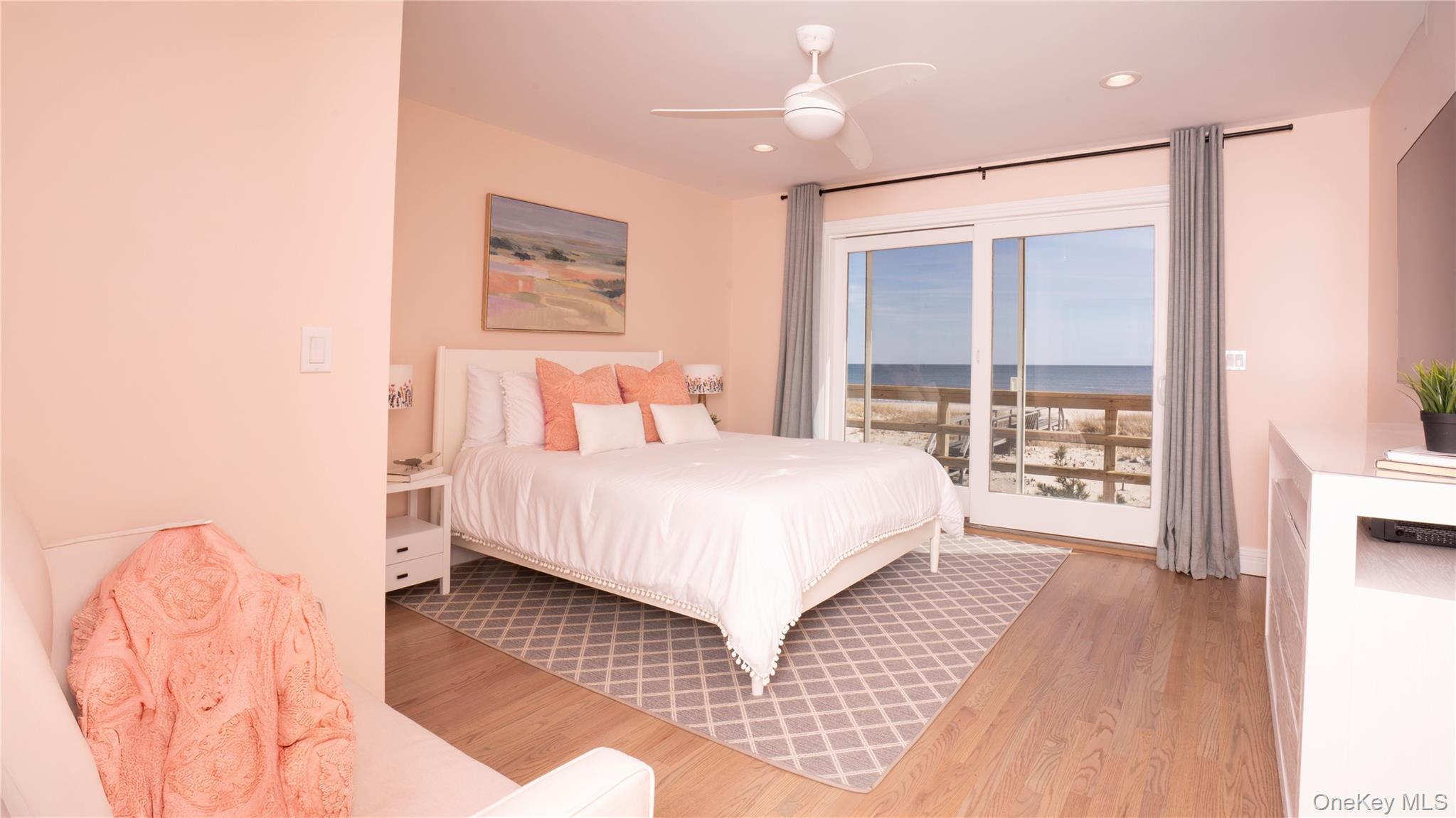 825 Dune Road Westhampton Beach, NY 11978 - Photo 32 of 50 a bedroom with a large bed and a large window