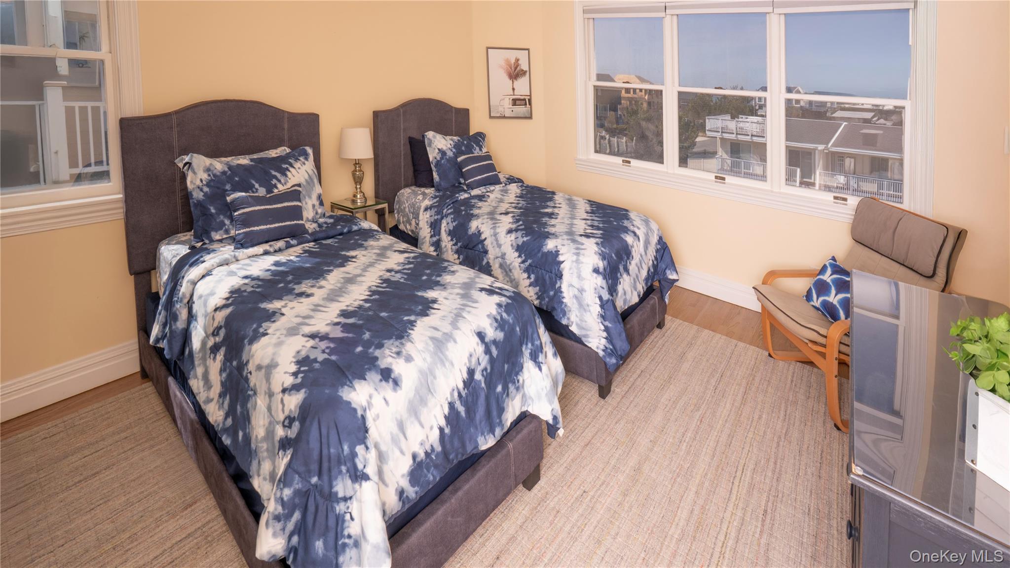 825 Dune Road Westhampton Beach, NY 11978 - Photo 36 of 50 a bed sitting in a bedroom next to a window