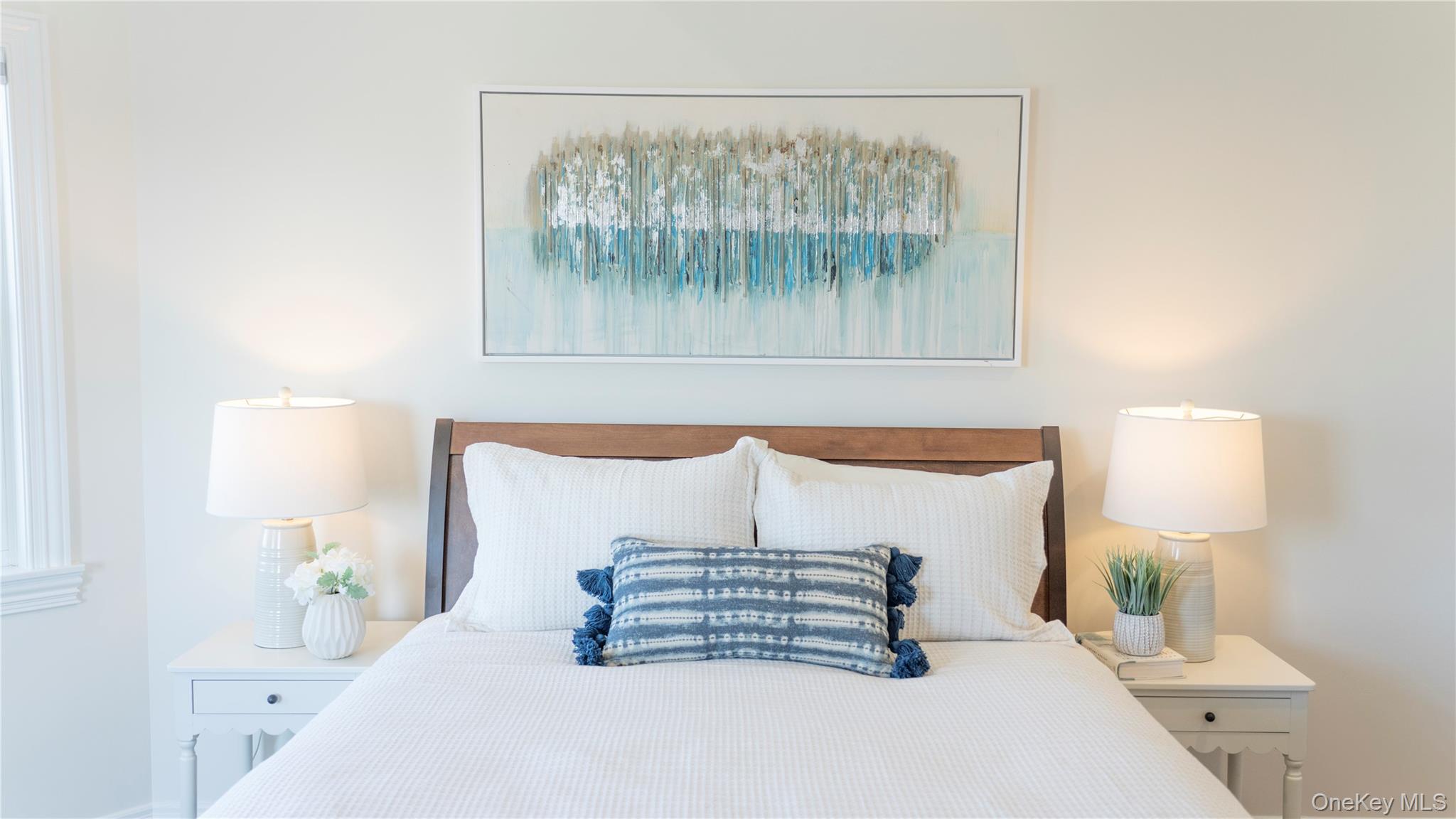 825 Dune Road Westhampton Beach, NY 11978 - Photo 39 of 50 a bedroom with a bed and a night stand