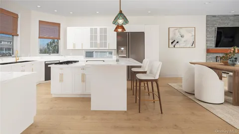 a living room with furniture and fireplace