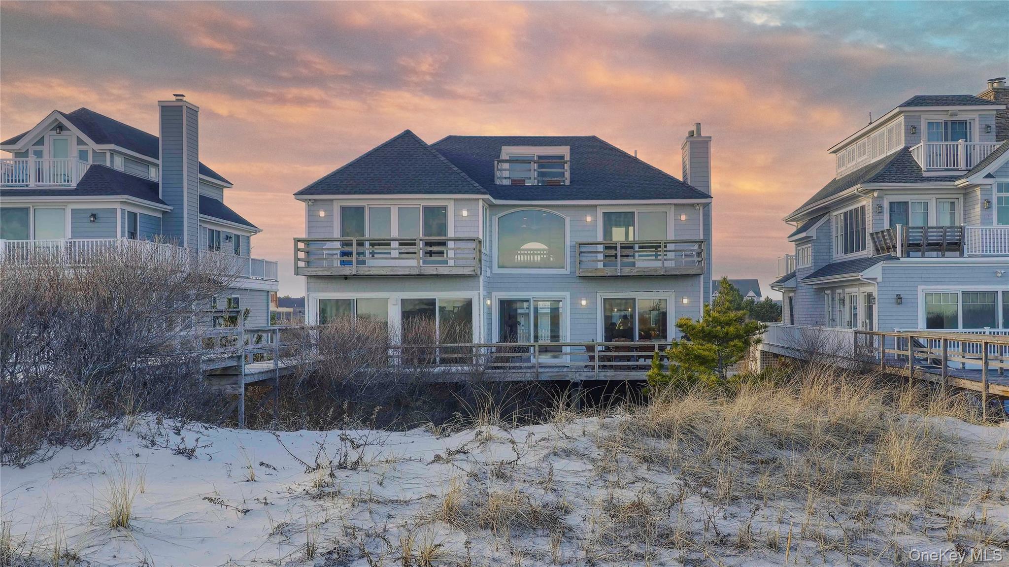 825 Dune Road Westhampton Beach, NY 11978 - Photo 8 of 50 a front view of a house with yard and barbeque oven