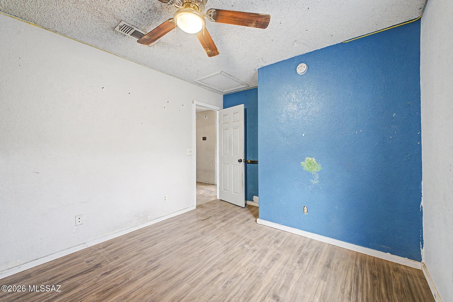 9810 East Stonehaven Way Tucson, AZ 85747 - Photo 21 of 27 a view of an empty room with a fan