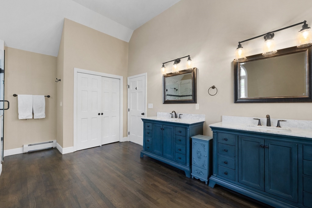 71 Porter Road Boxford, MA 01921 - Photo 17 of 37 a bathroom with double vanity sink and mirror