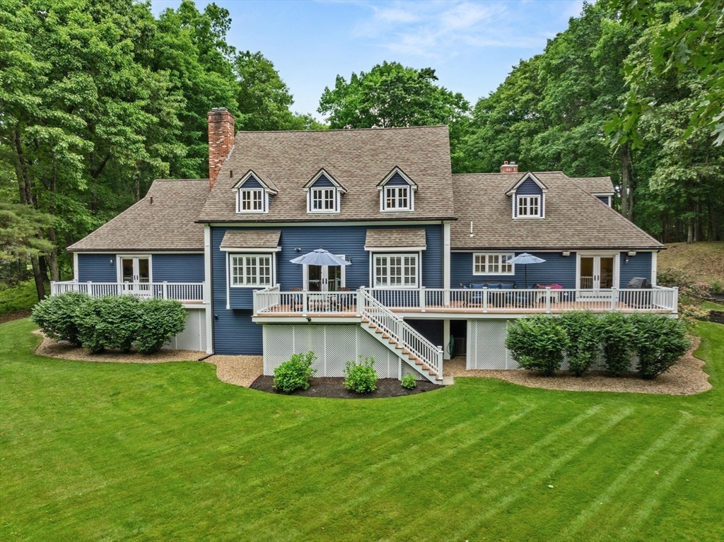 71 Porter Road Boxford, MA 01921 - Photo 30 of 37 a front view of a house with a yard