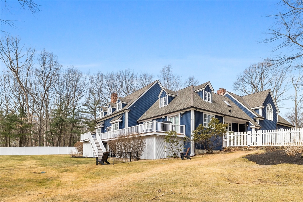 71 Porter Road Boxford, MA 01921 - Photo 37 of 37 a front view of a house with a yard