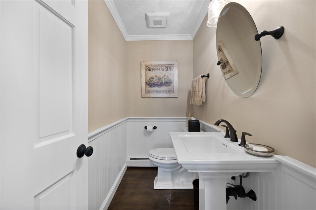 71 Porter Road Boxford, MA 01921 - Photo 5 of 37 a bathroom with a sink and mirror with toilet