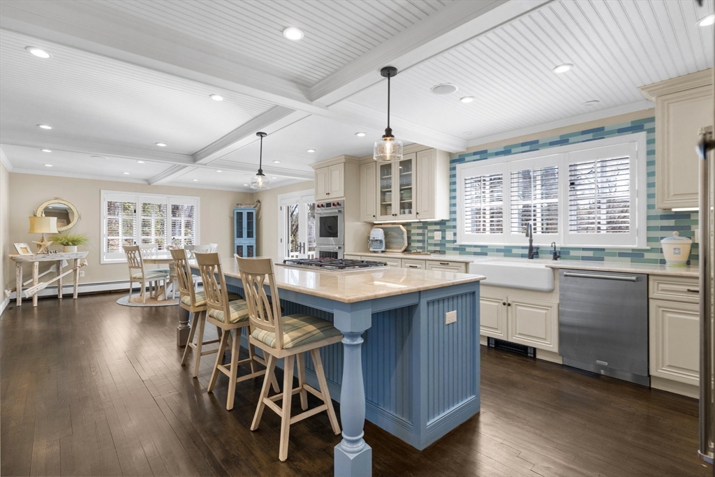 71 Porter Road Boxford, MA 01921 - Photo 8 of 37 a kitchen with lots of counter top space and dining table