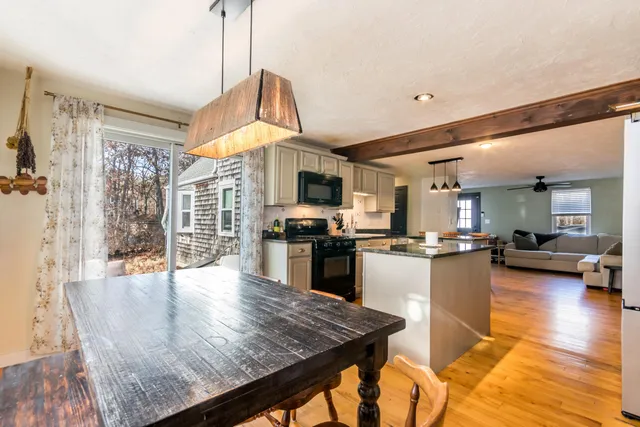 a kitchen with a table and chairs in it
