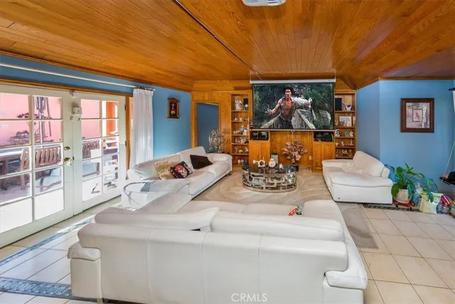 a view of living room with furniture and floor to ceiling window