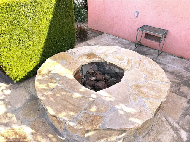 a view of a backyard with chairs